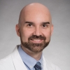 Cory Simpson, MD, PhD, FAAD